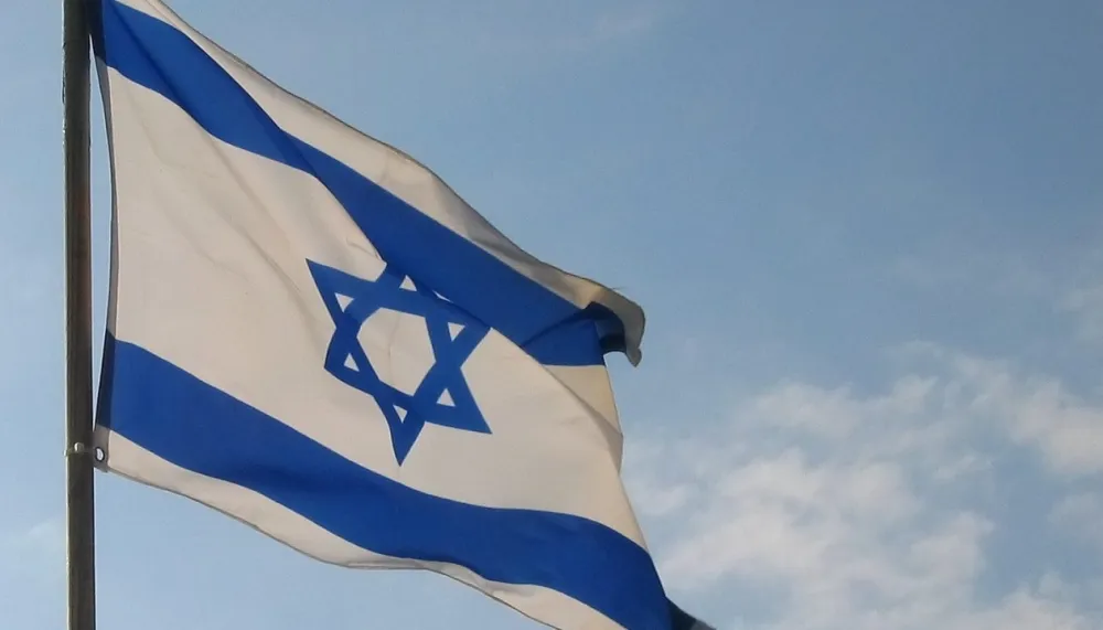 以色列国国旗以色列国国旗上面是一颗大卫星(六角星),象征着国家的